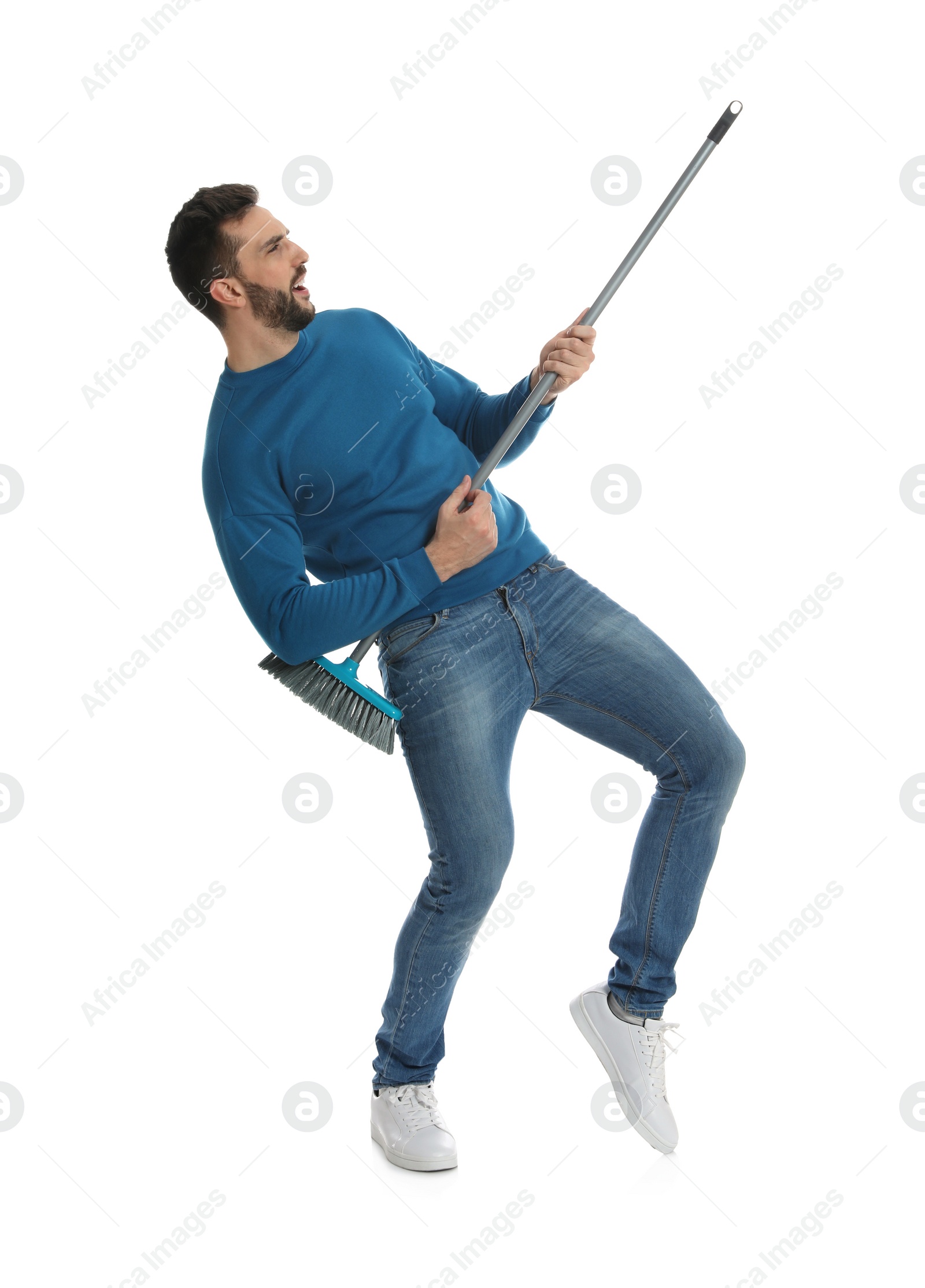 Photo of Man with broom having fun on white background