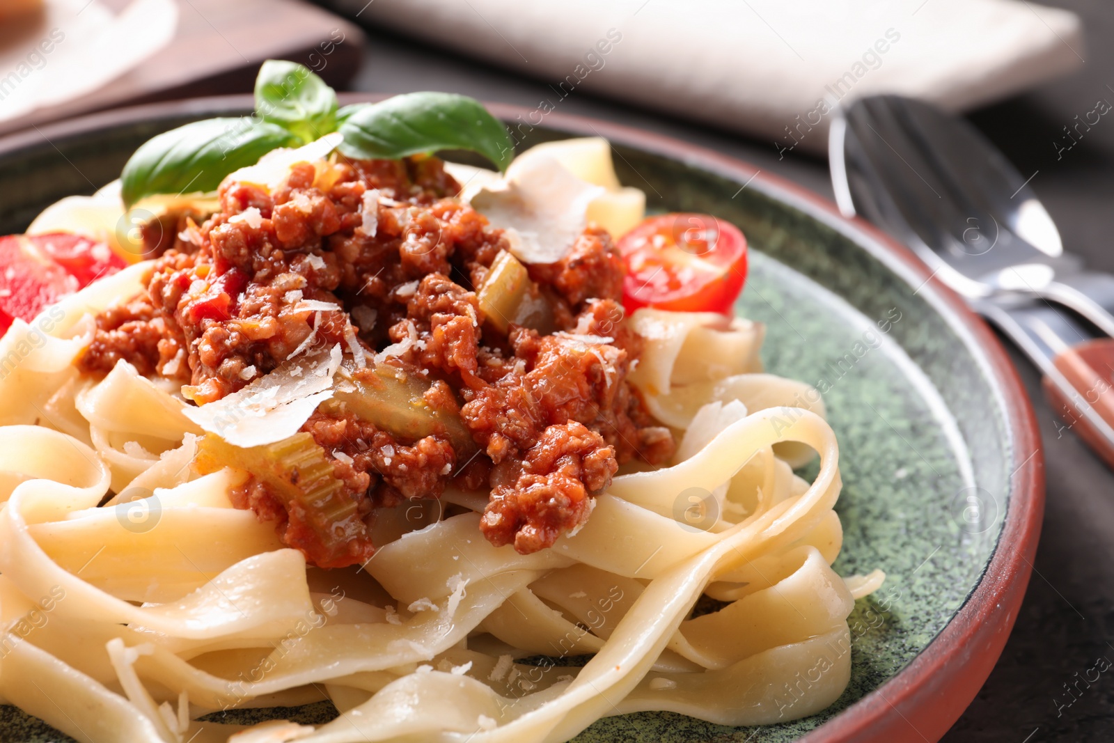 Photo of Plate with delicious pasta bolognese, closeup