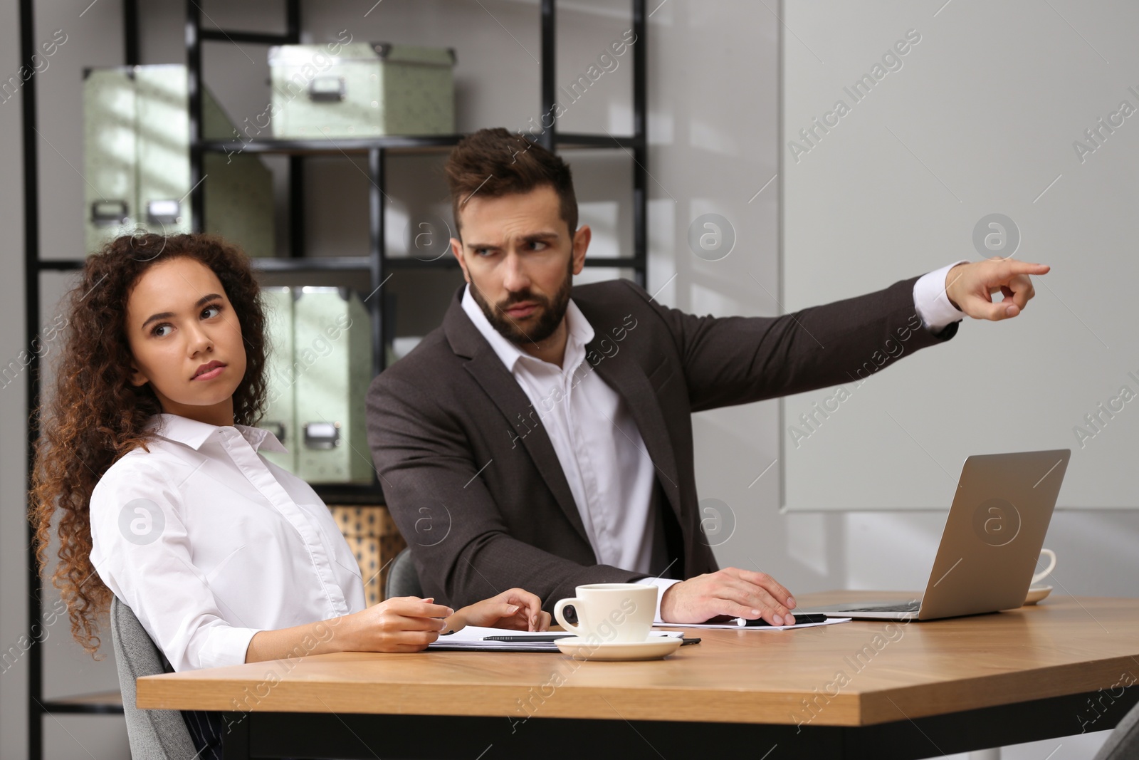 Photo of African American woman suffering from racial discrimination at work