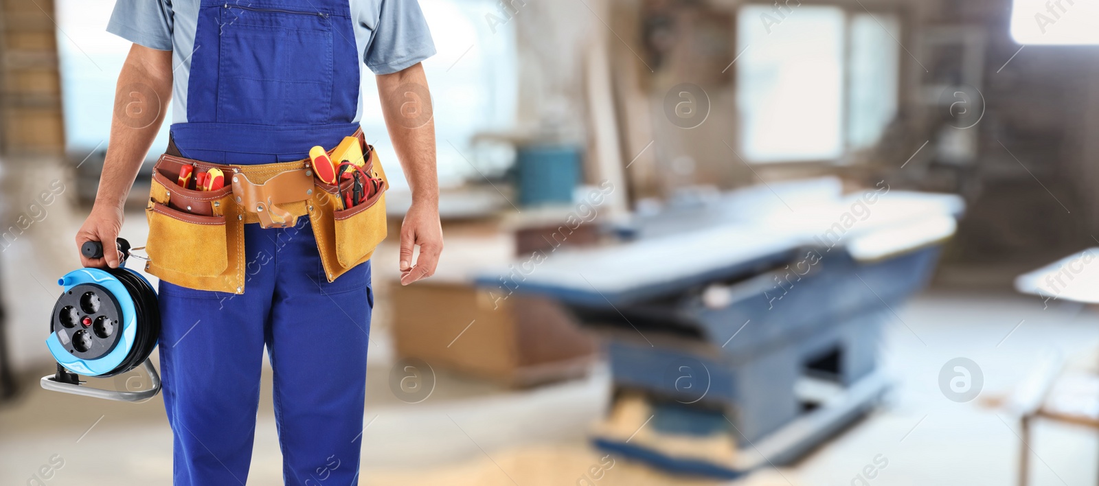 Image of Closeup view of electrician with tools indoors, space for text. Banner design