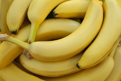 Photo of Many tasty bananas as background, closeup view