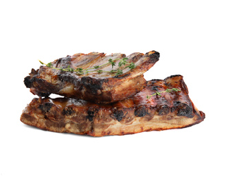 Tasty grilled ribs with thyme isolated on white