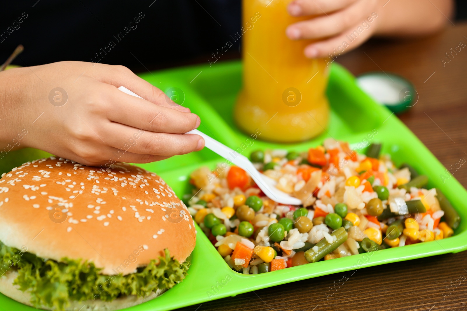 Photo of Child with healthy food for school lunch at desk, closeup