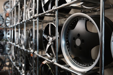 Alloy wheels on racks in automobile service center