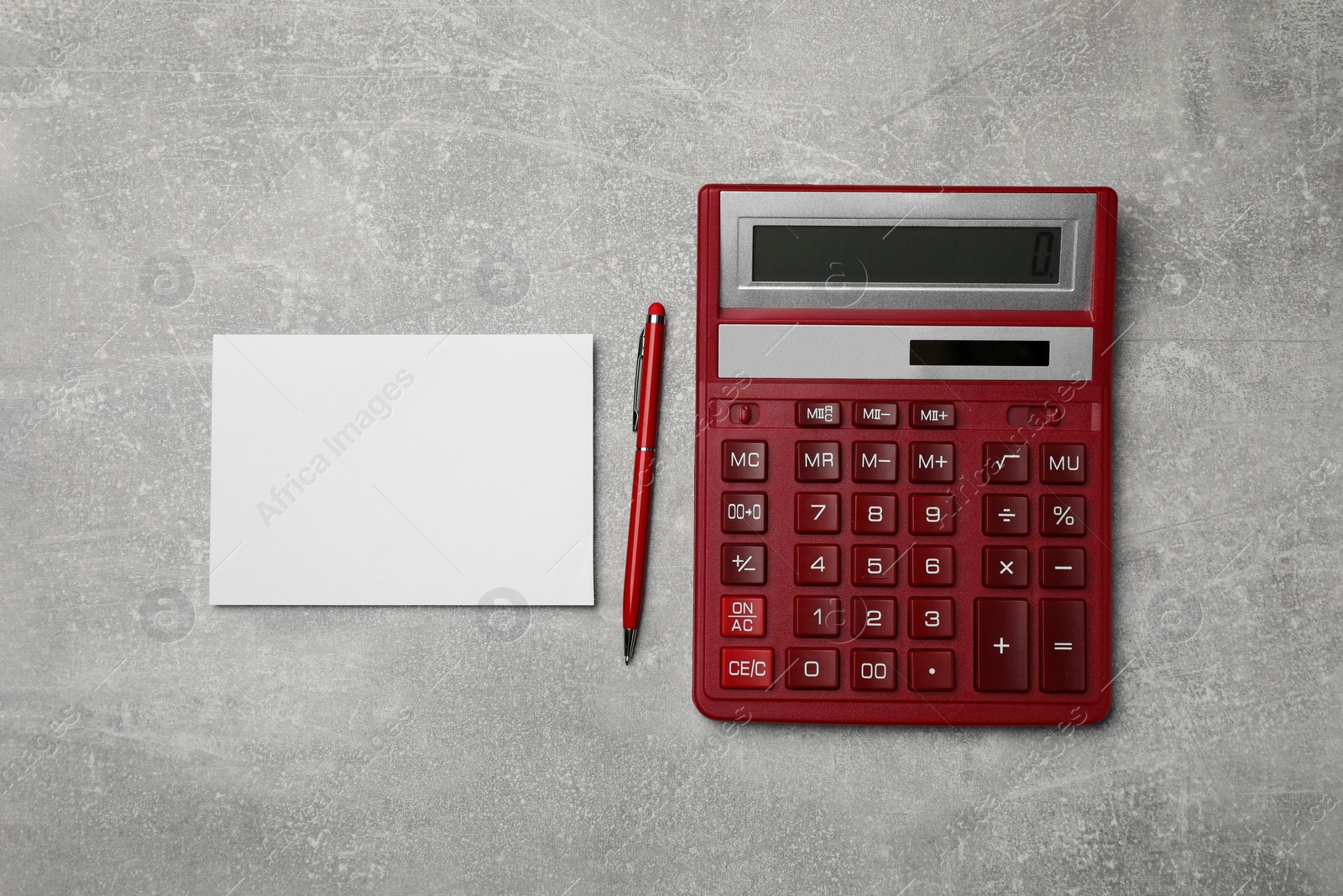 Photo of Calculator and office stationery on grey table, flat lay. Space for text