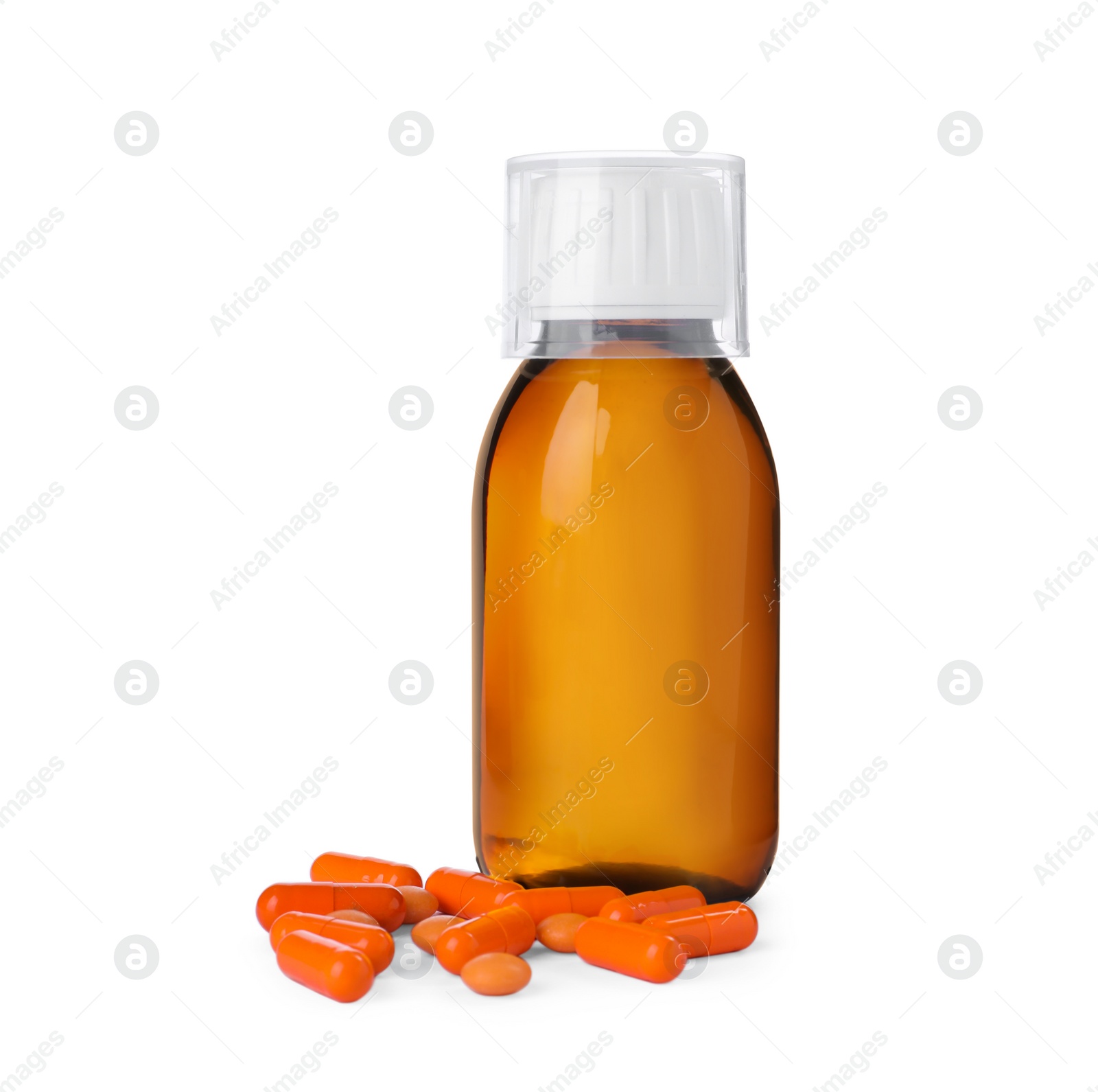 Photo of Bottle of syrup, measuring cup with pills on white background. Cough and cold medicine