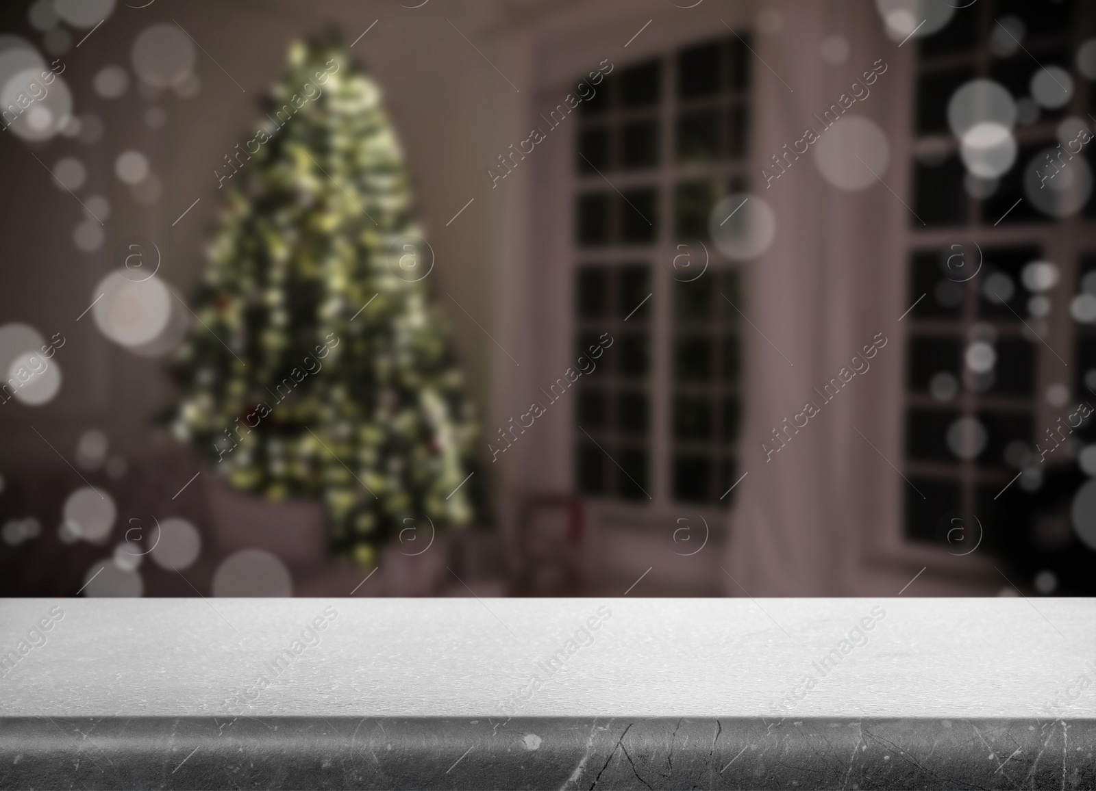 Image of Empty stone surface and blurred view of room decorated for Christmas