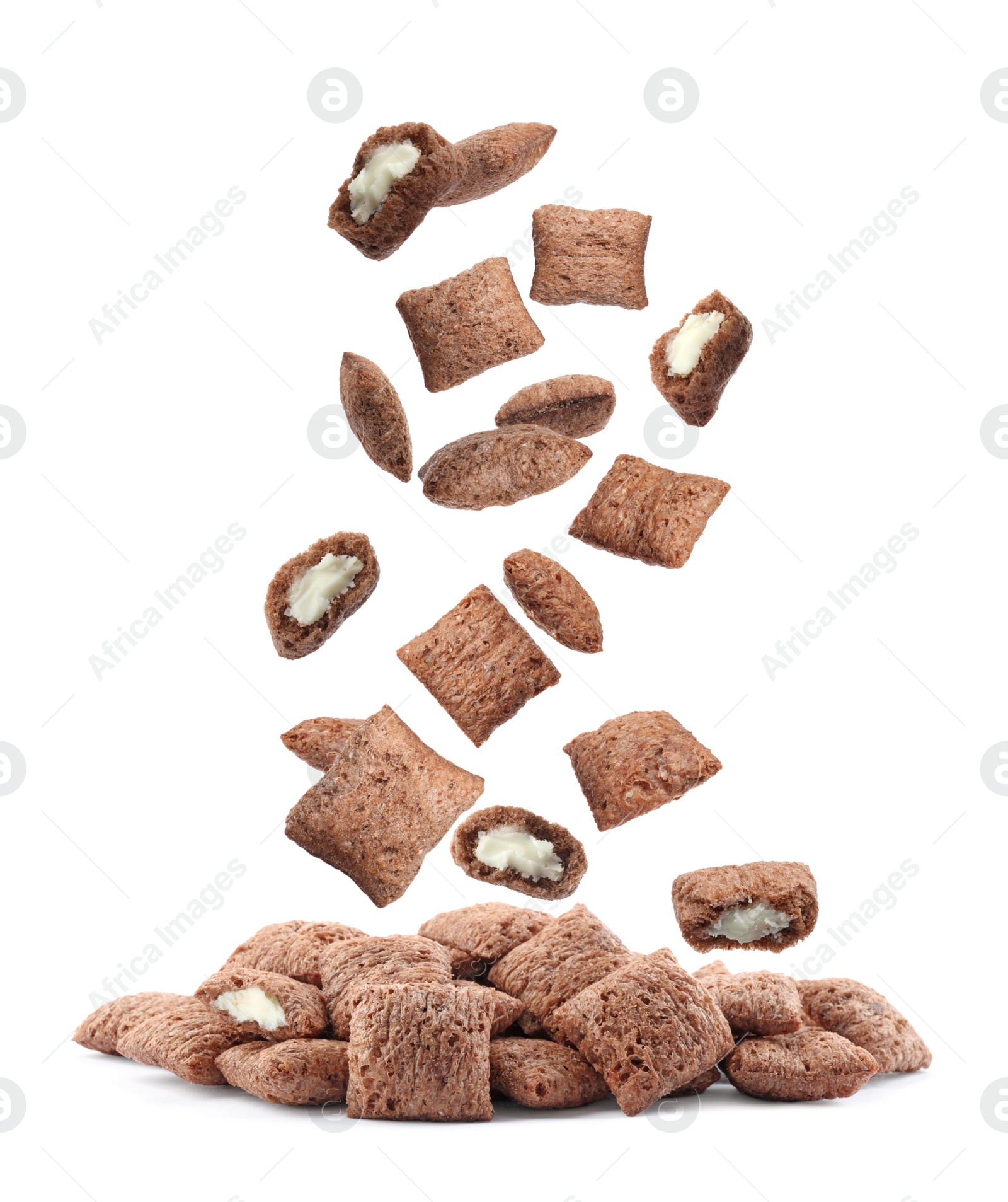 Image of Sweet crispy corn pads falling into pile on white background 