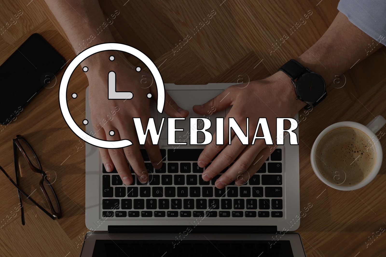 Image of Webinar concept. Man working with laptop at table indoors, top view