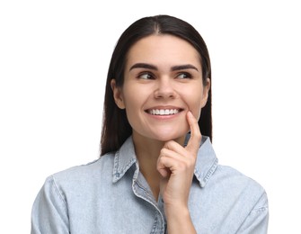 Photo of Young woman showing her clean teeth and smiling on white background