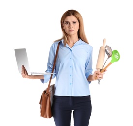 Photo of Portrait of businesswoman with briefcase holding kitchen utensils and laptop on white background. Combining life and work
