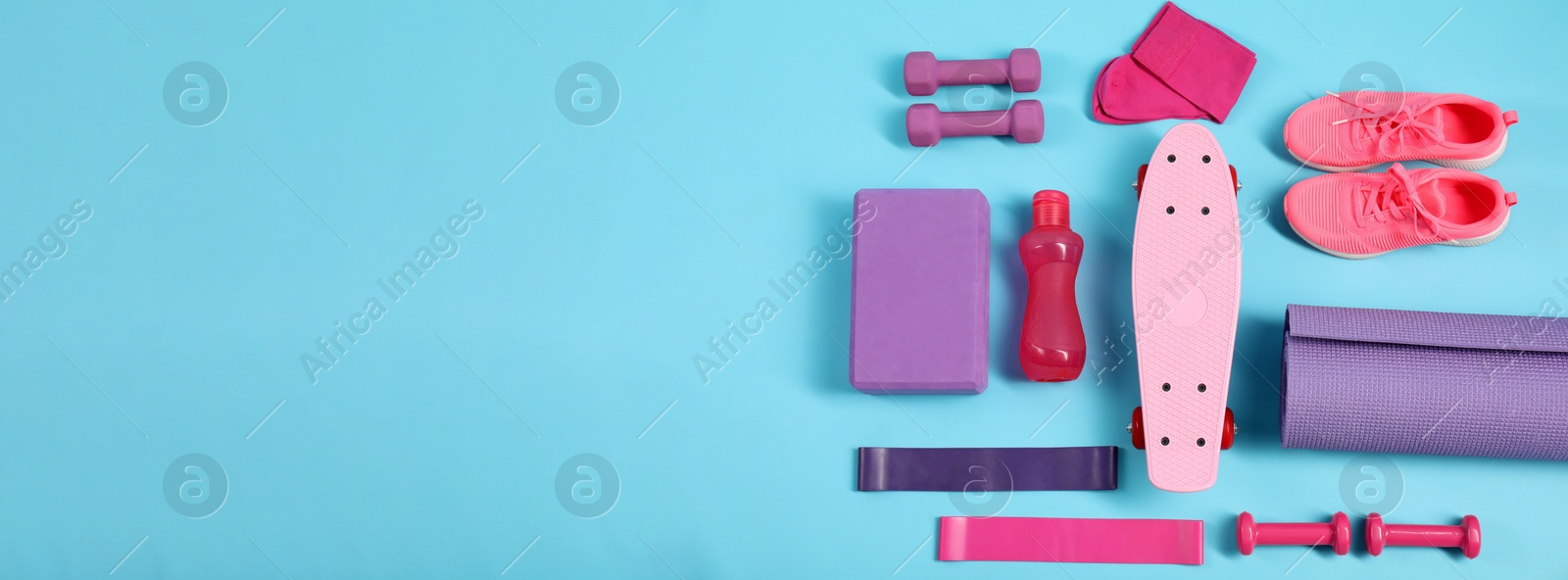 Photo of Different sports equipment on light blue background, flat lay