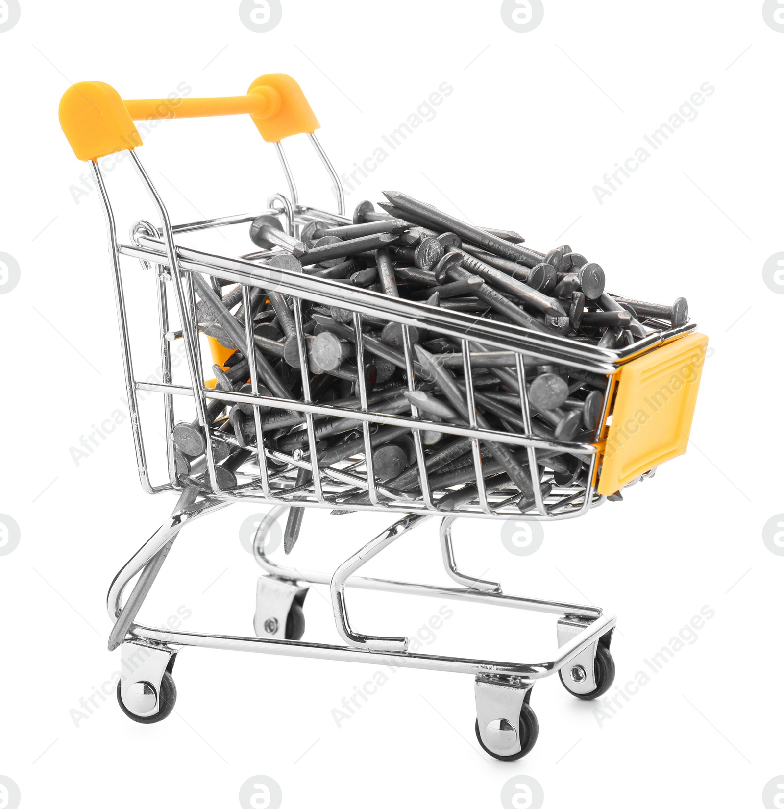 Photo of Metal nails in shopping cart isolated on white