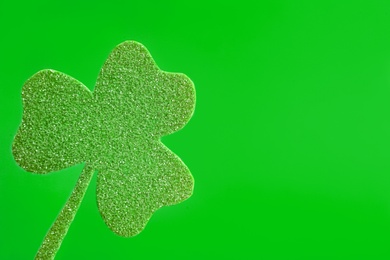 Photo of Decorative clover leaf on green background, space for text. Saint Patrick's Day celebration