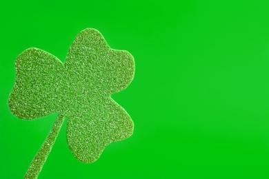 Decorative clover leaf on green background, space for text. Saint Patrick's Day celebration