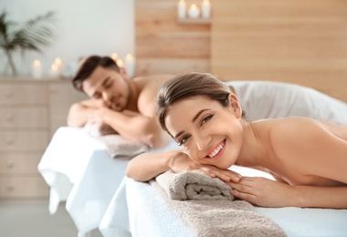 Romantic young couple relaxing in spa salon
