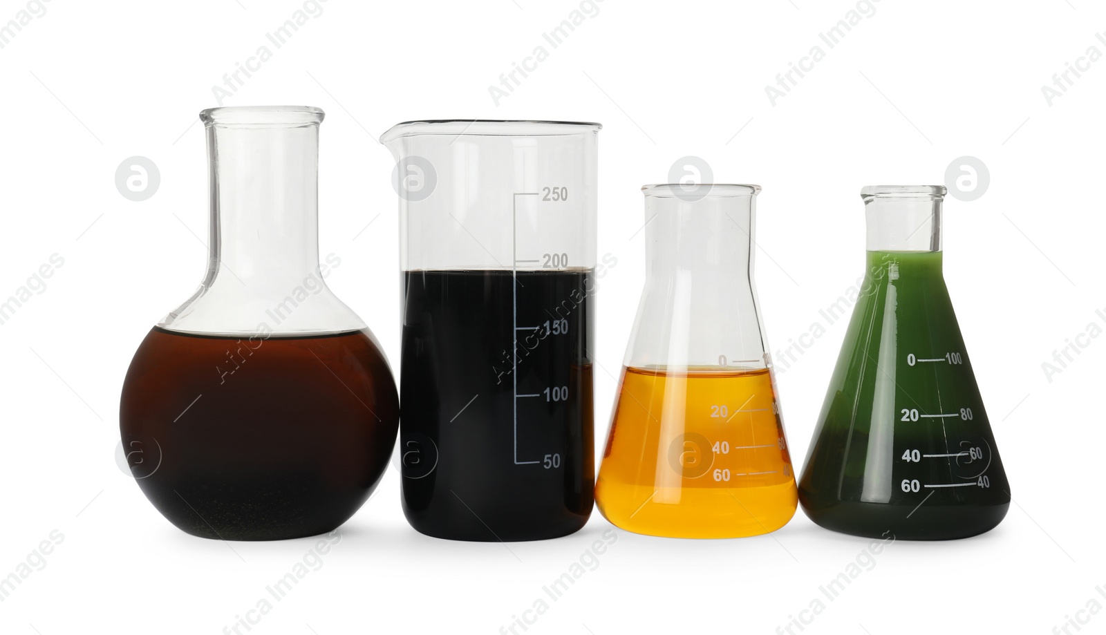 Photo of Laboratory glassware with different types of crude oil isolated on white