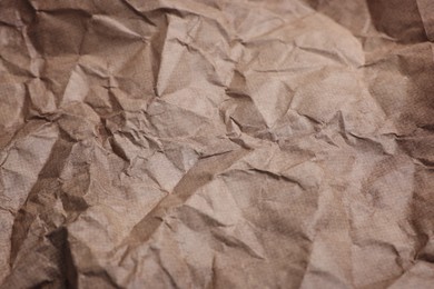 Photo of Texture of crumpled parchment paper as background, closeup