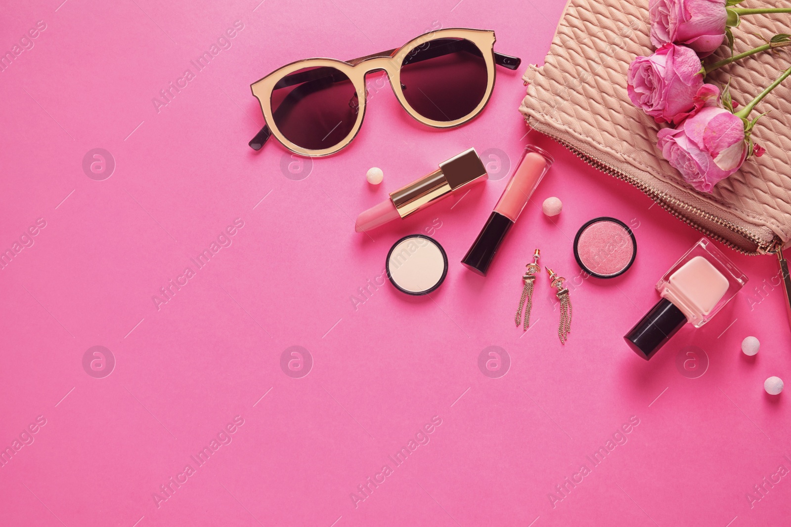 Photo of Flat lay composition with products for decorative makeup on pink background