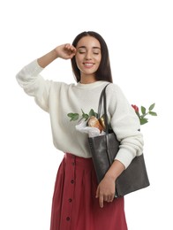 Young woman with leather shopper bag on white background