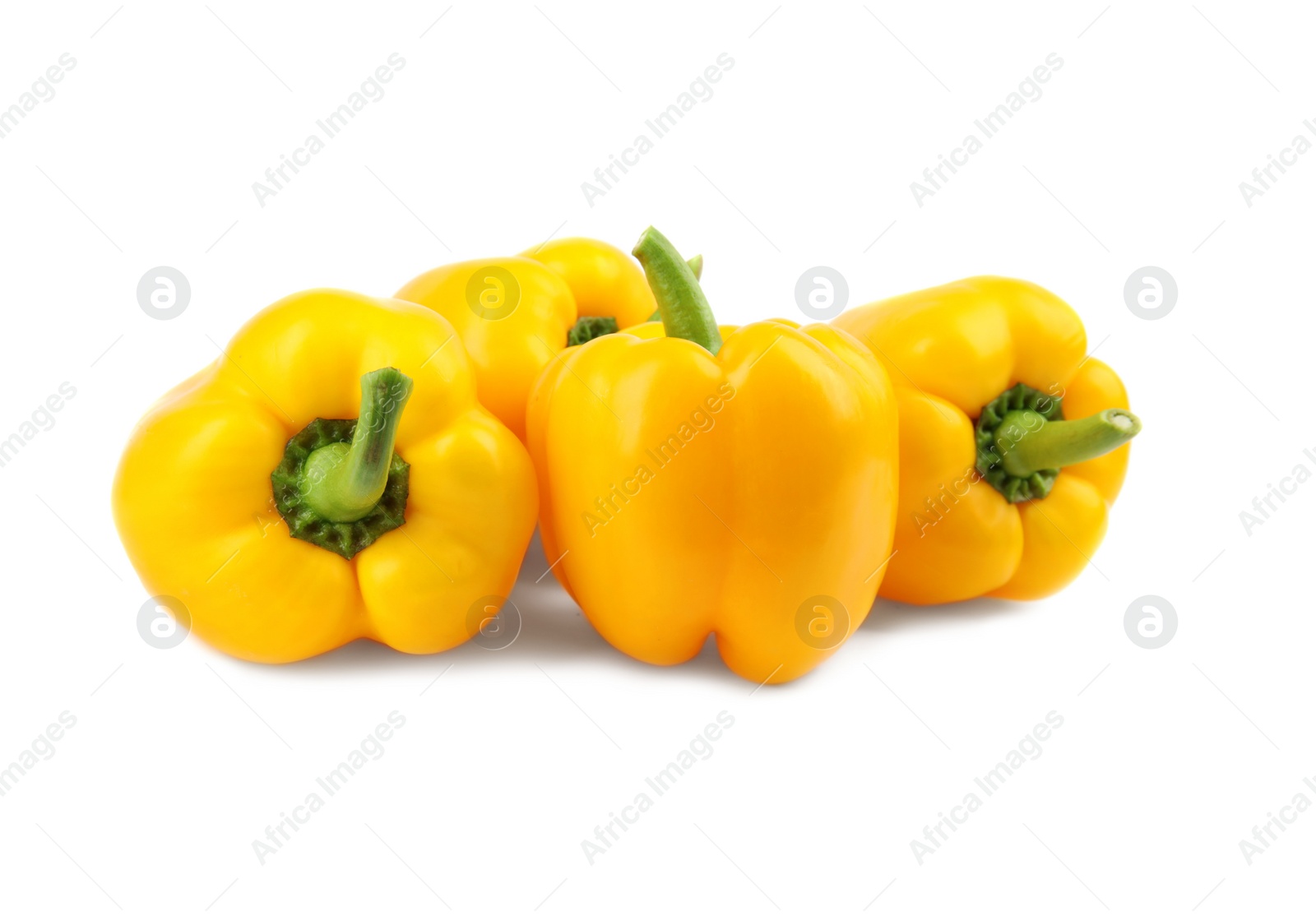 Photo of Ripe yellow bell peppers isolated on white