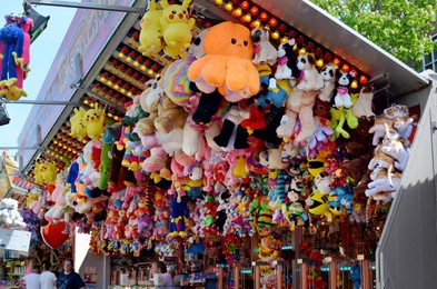 Netherlands, Groningen - May 18, 2022: Beautiful stall with different toys for winning in amusement park