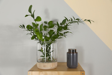 Photo of Shelving unit with toiletries near light wall indoors. Bathroom interior element