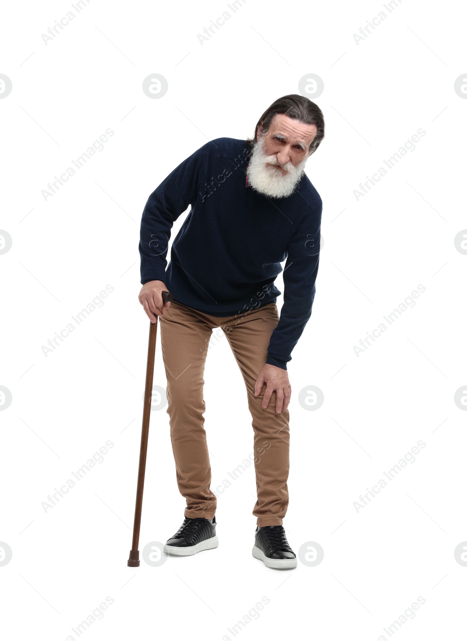 Photo of Senior man with walking cane suffering from knee pain on white background