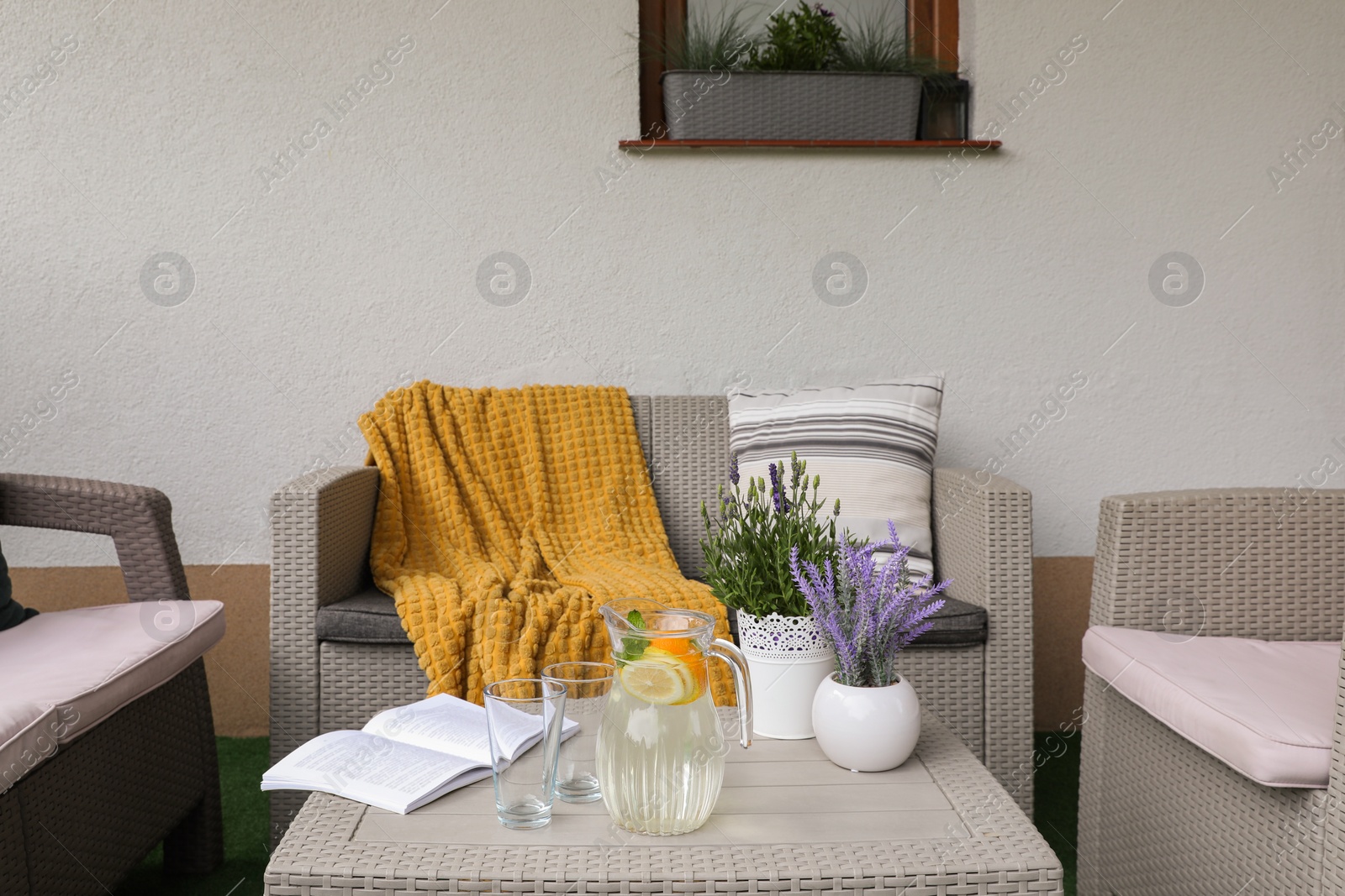 Photo of Comfortable furniture with beautiful decor on outdoor terrace