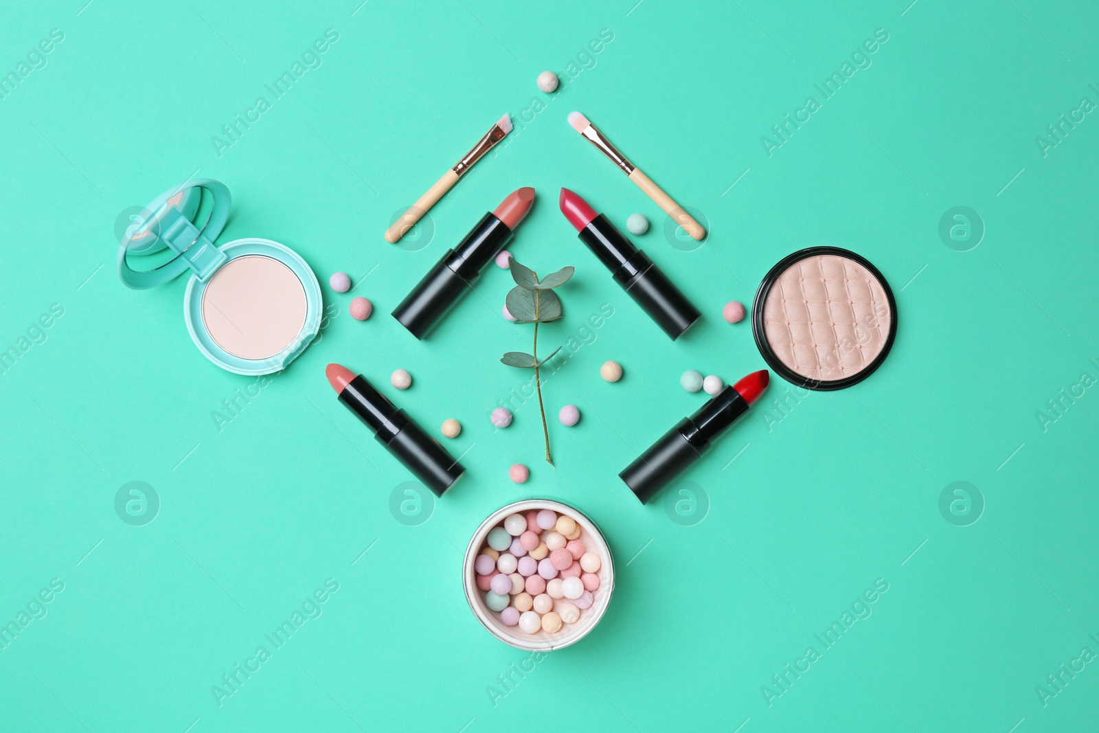 Photo of Decorative makeup products on color background