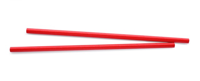 Photo of Red paper cocktail straws on white background