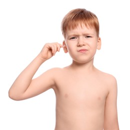 Photo of Little boy cleaning ear with cotton swab on white background