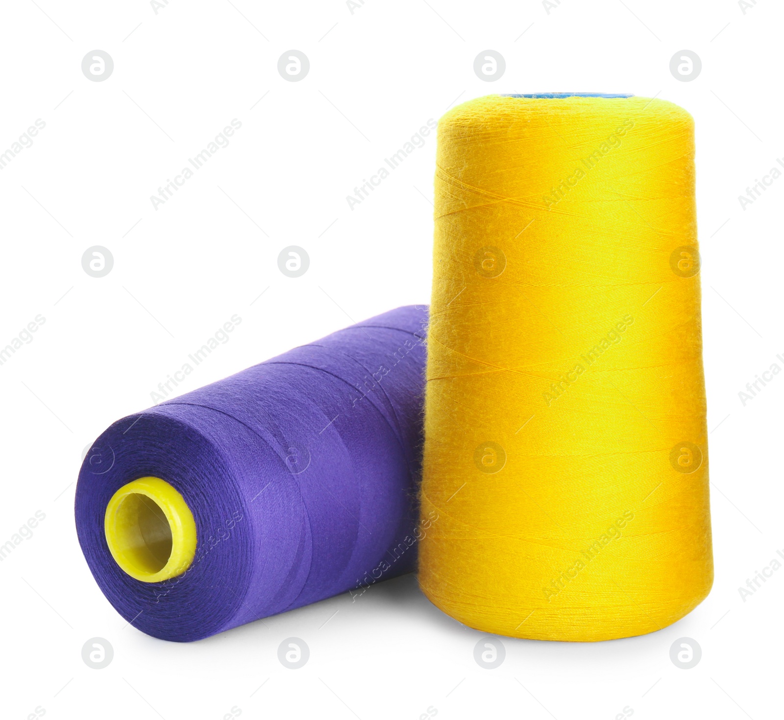 Photo of Different colorful sewing threads on white background