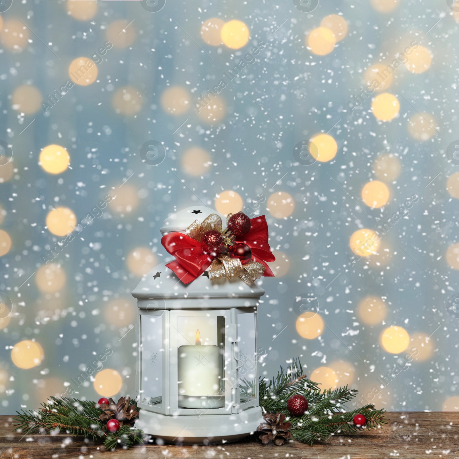 Image of Composition with Christmas lantern on wooden table. Bokeh effect