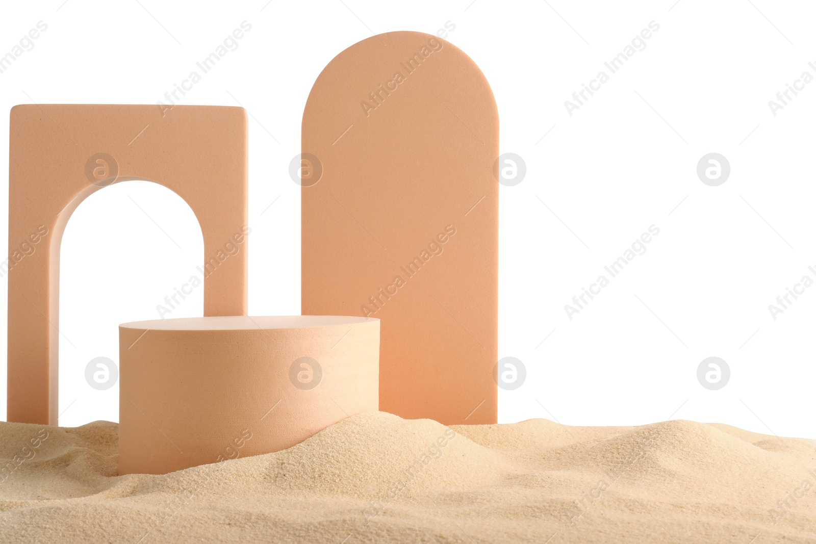 Photo of Presentation of product. Different podiums on sand against white background