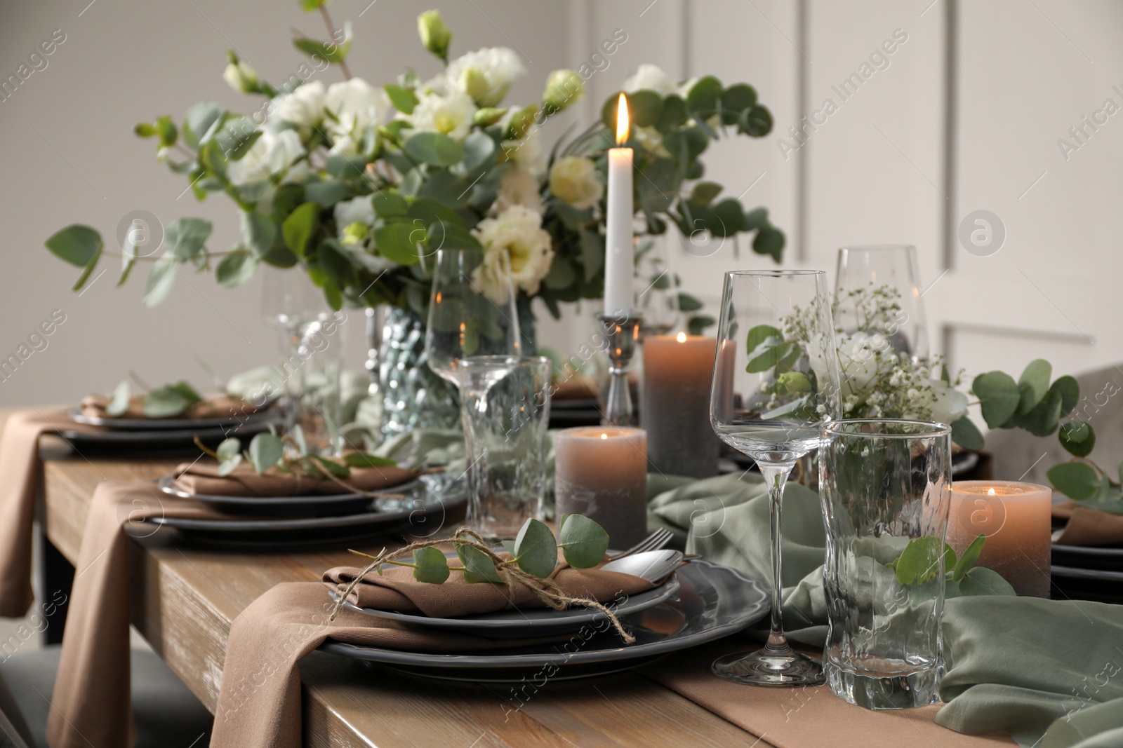 Photo of Festive table setting with beautiful floral decor indoors