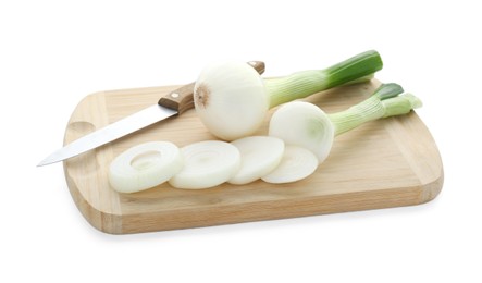 Photo of Wooden board with knife, whole and cut spring onions isolated on white