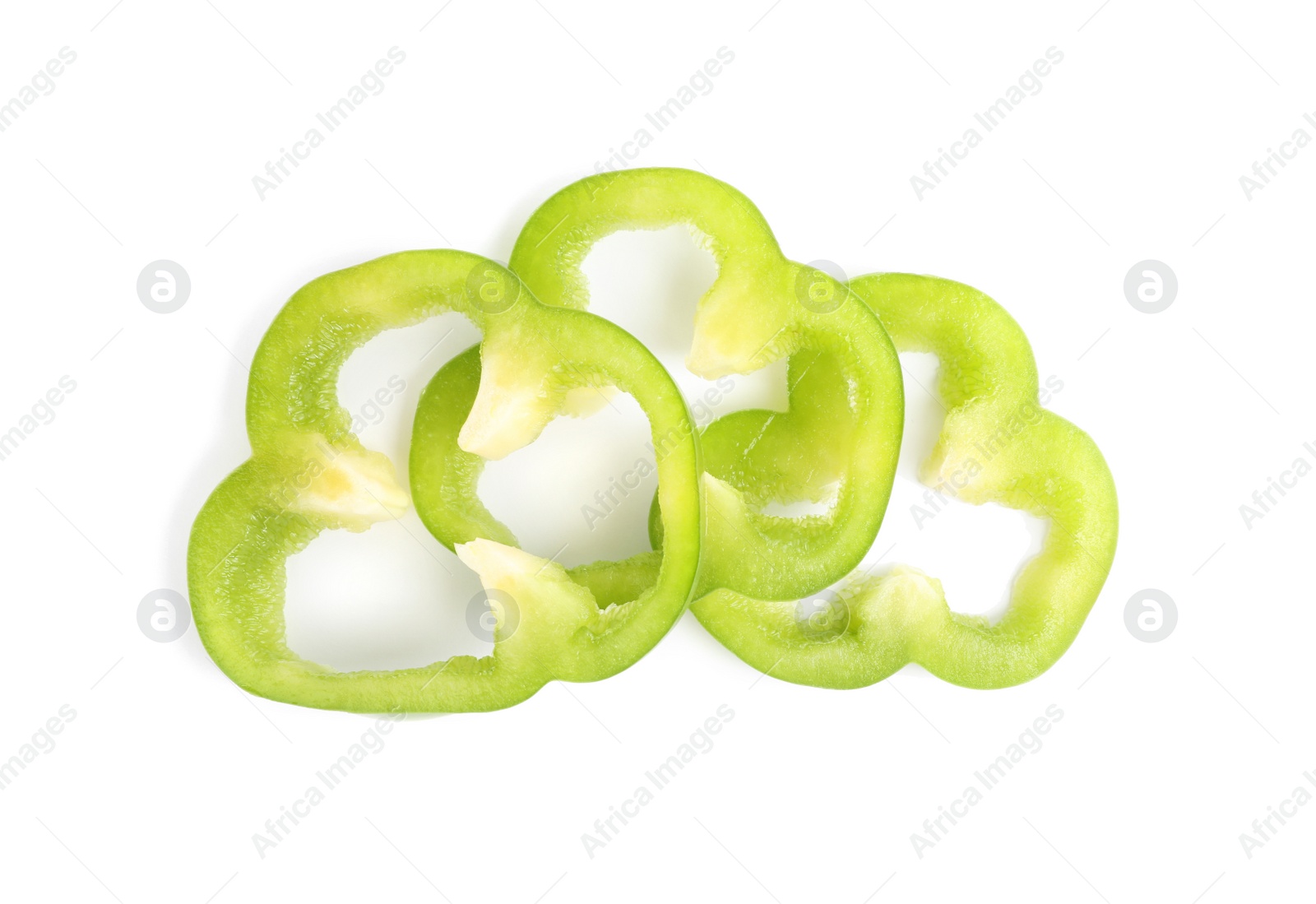Photo of Slices of ripe green bell pepper isolated on white, top view