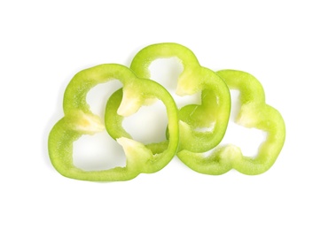 Slices of ripe green bell pepper isolated on white, top view