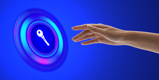 Image of Concept of keywords research and modern technology. Woman pointing at key icon on blue background, banner design