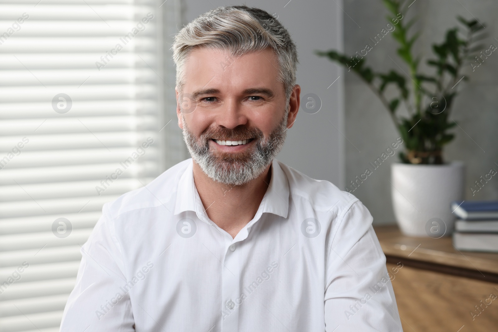 Photo of Happy man having video call at home, view from web camera