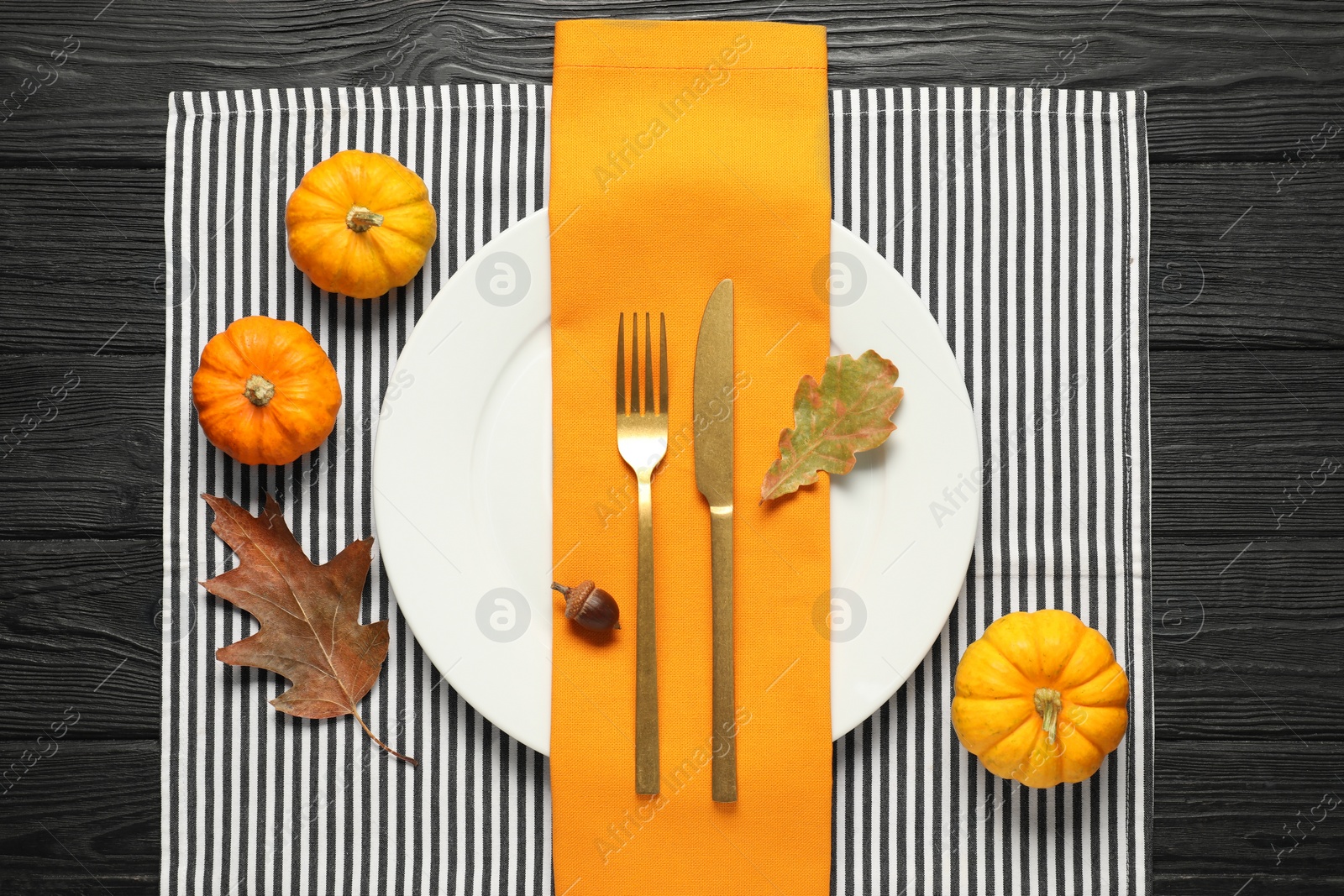 Photo of Autumn table setting, pumpkins and dry leaves, flat lay