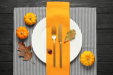 Photo of Autumn table setting, pumpkins and dry leaves, flat lay