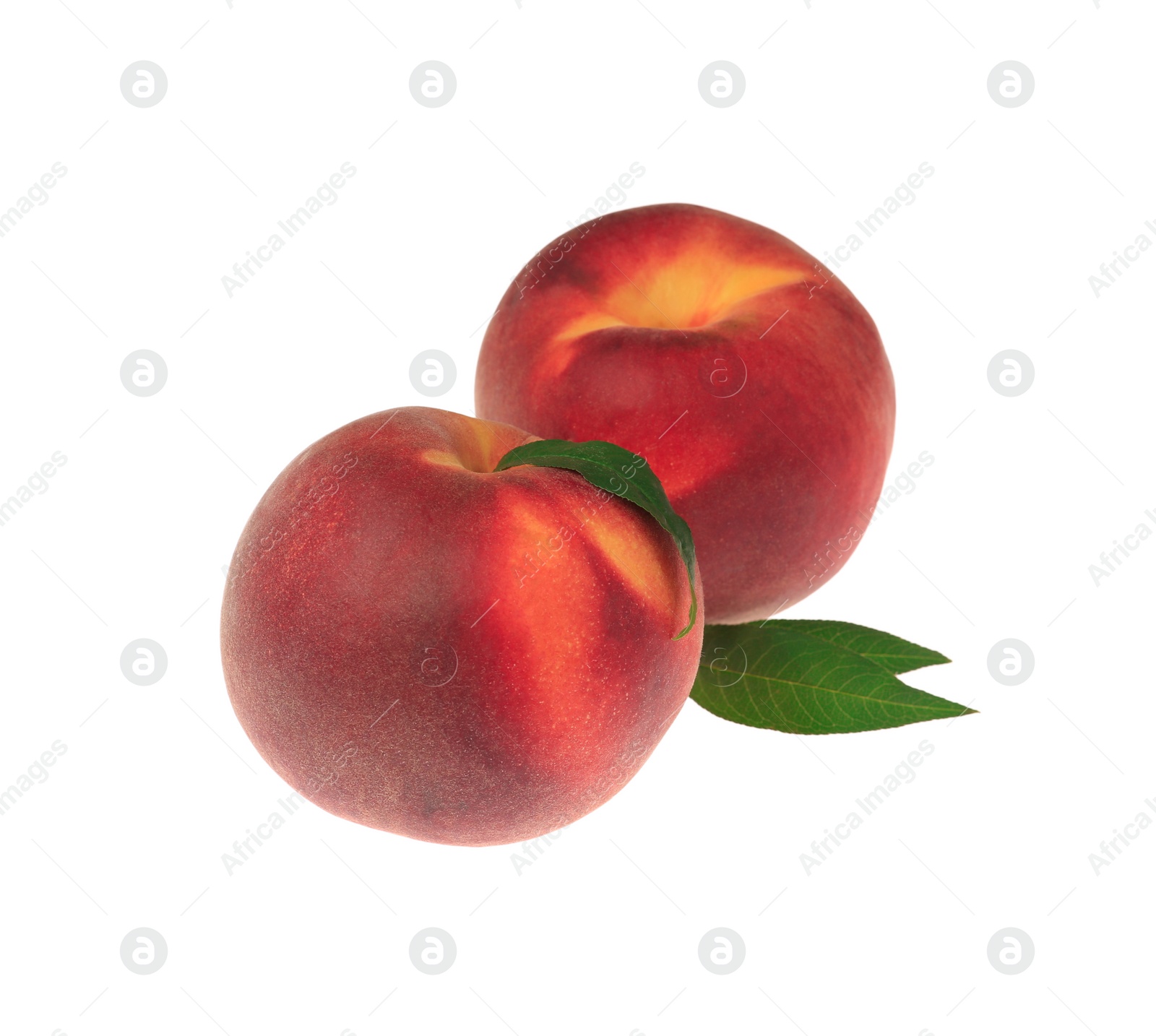 Photo of Delicious fresh ripe peaches with green leaves isolated on white