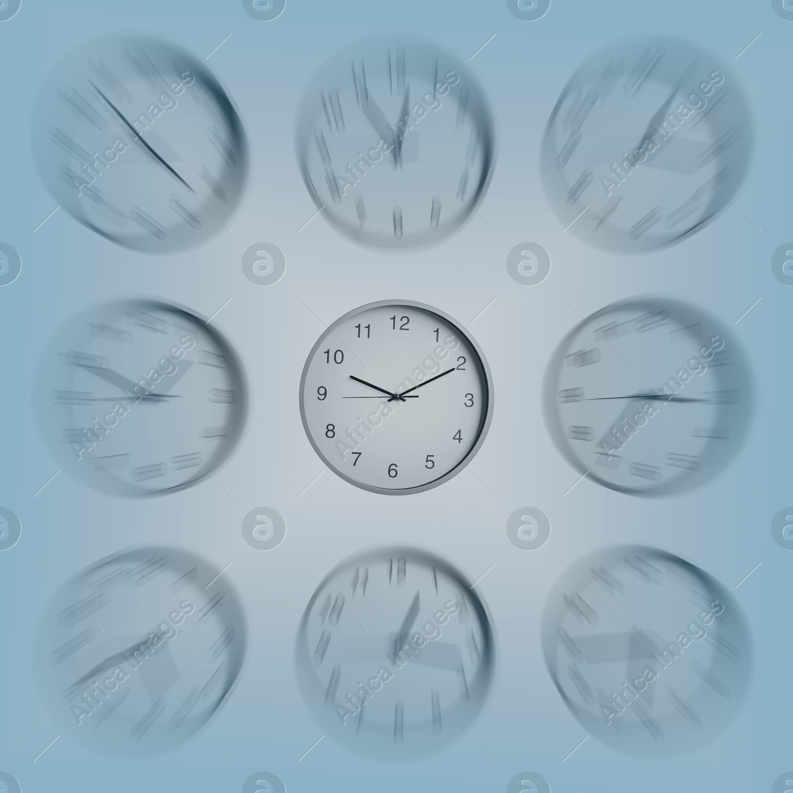 Image of Many clocks on light blue background, motion blur effect. Time concept