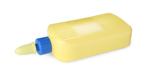 Photo of Blank yellow bottle and drop of glue on white background