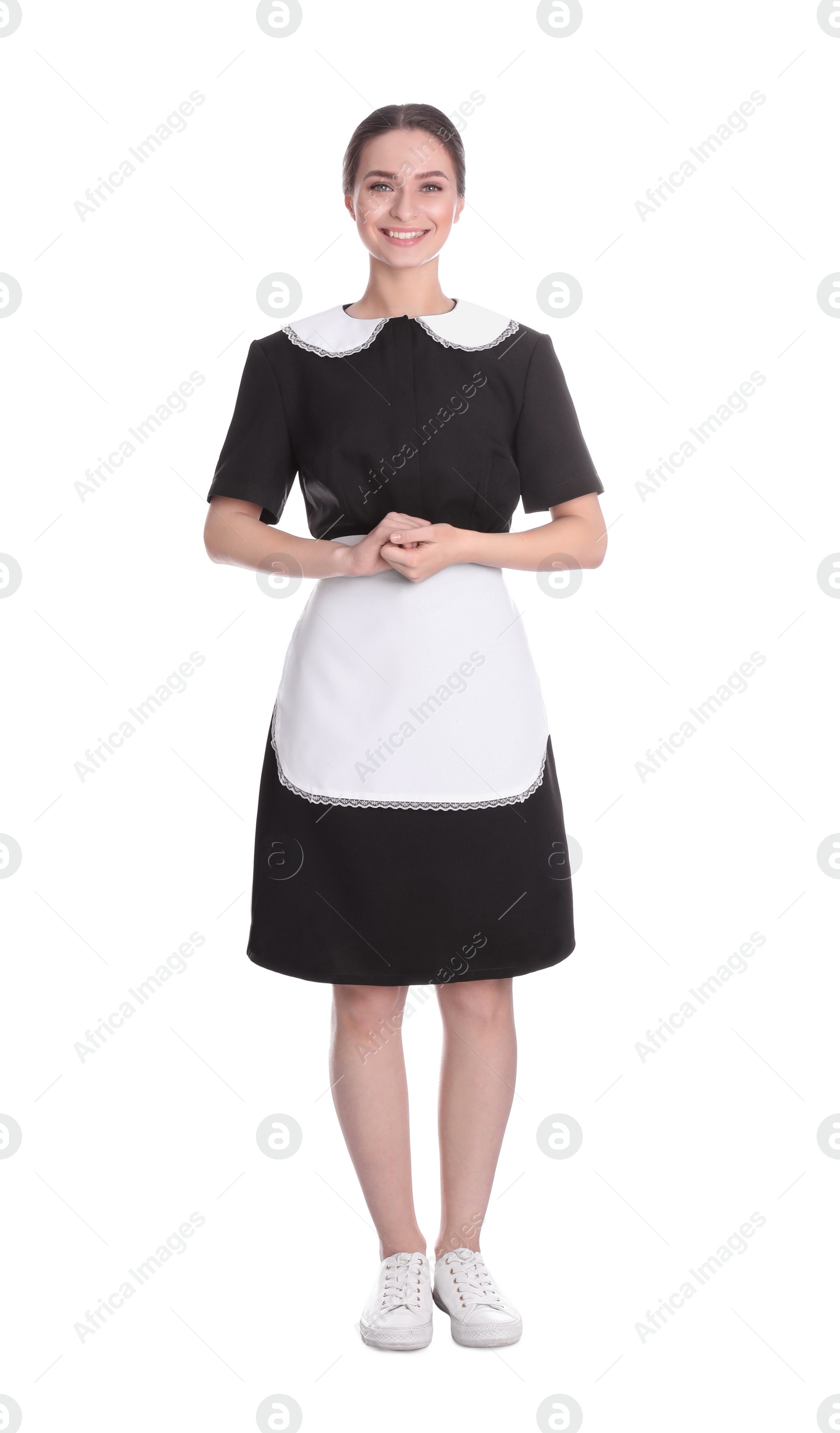 Photo of Young chambermaid in uniform on white background