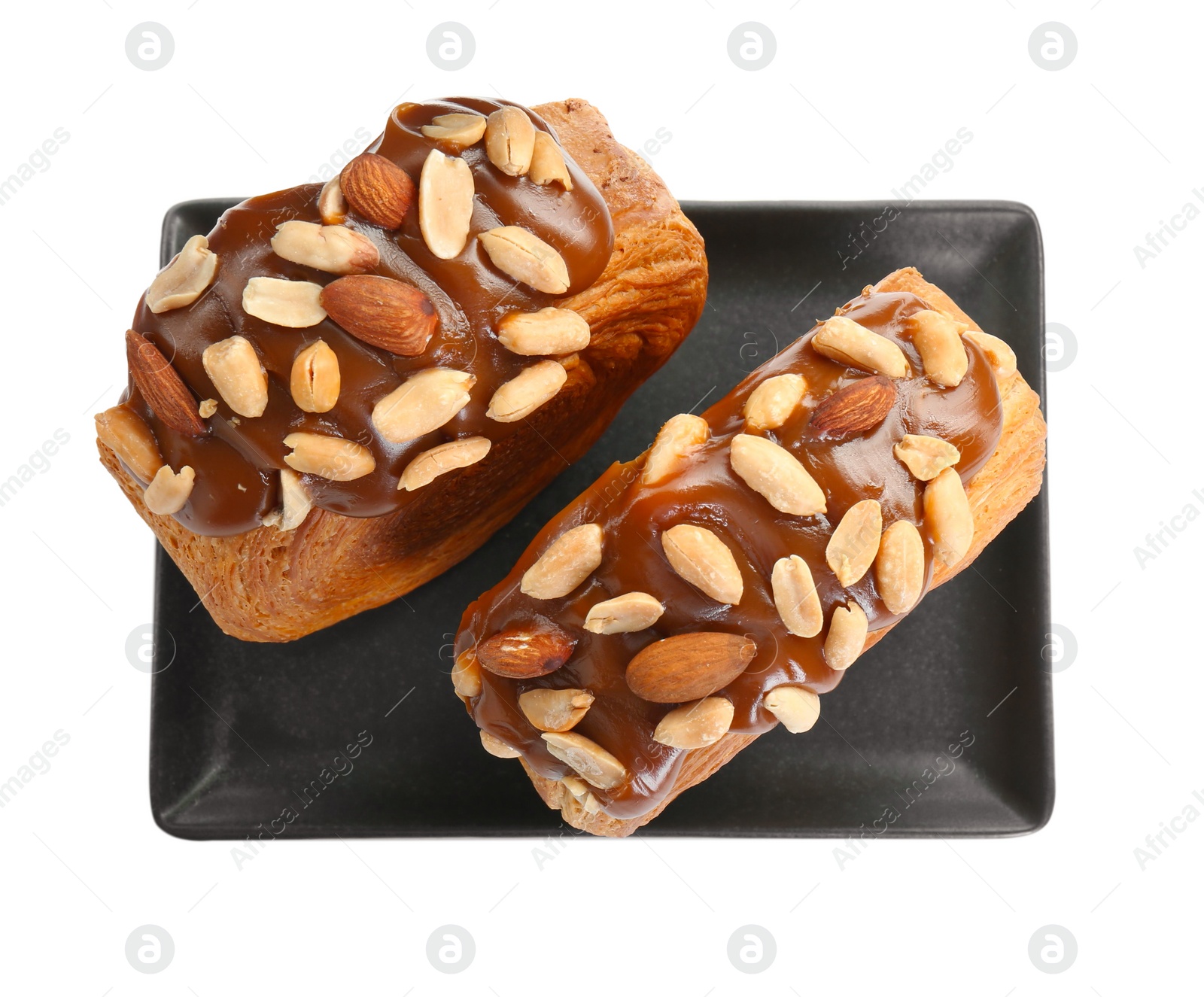 Photo of Round croissants with chocolate paste and nuts isolated on white, top view. Tasty puff pastry