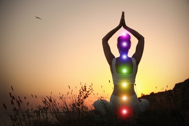 Image of Woman meditating outdoors at sunset, back view. Scheme of seven chakras, illustration