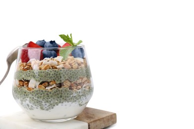 Photo of Tasty oatmeal with chia matcha pudding and berries on white tiled table, closeup. Space for text. Healthy breakfast
